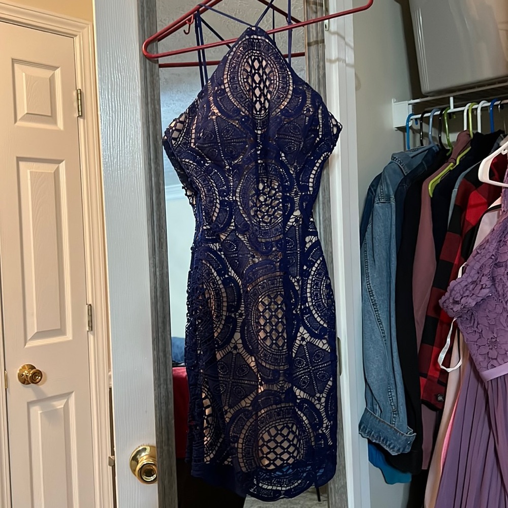 Halter nude mini dress with navy blue lace over lay pattern